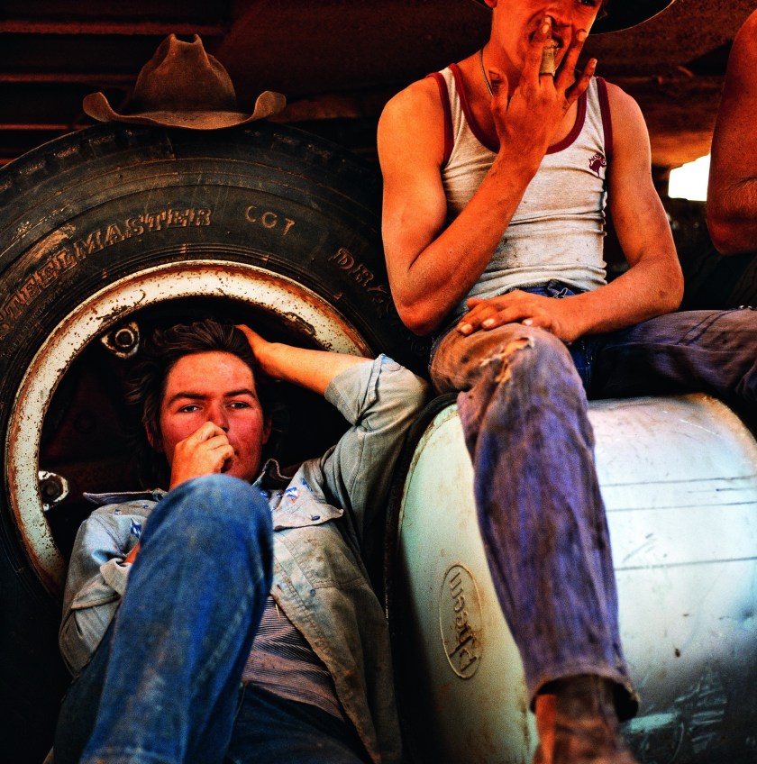 Resting in the shade of a tarpaulin. Jackaroo Malcolm Chillmon, 20, from Chippendale, New South Wales with Jillaroo Susan Gilmore from Brisbane, Queensland, and stationhand Mark Ashlin from Gulgung, New South Wales. (Balls and Bulldust by Hakan Ludwigson, publishd by Steidl)