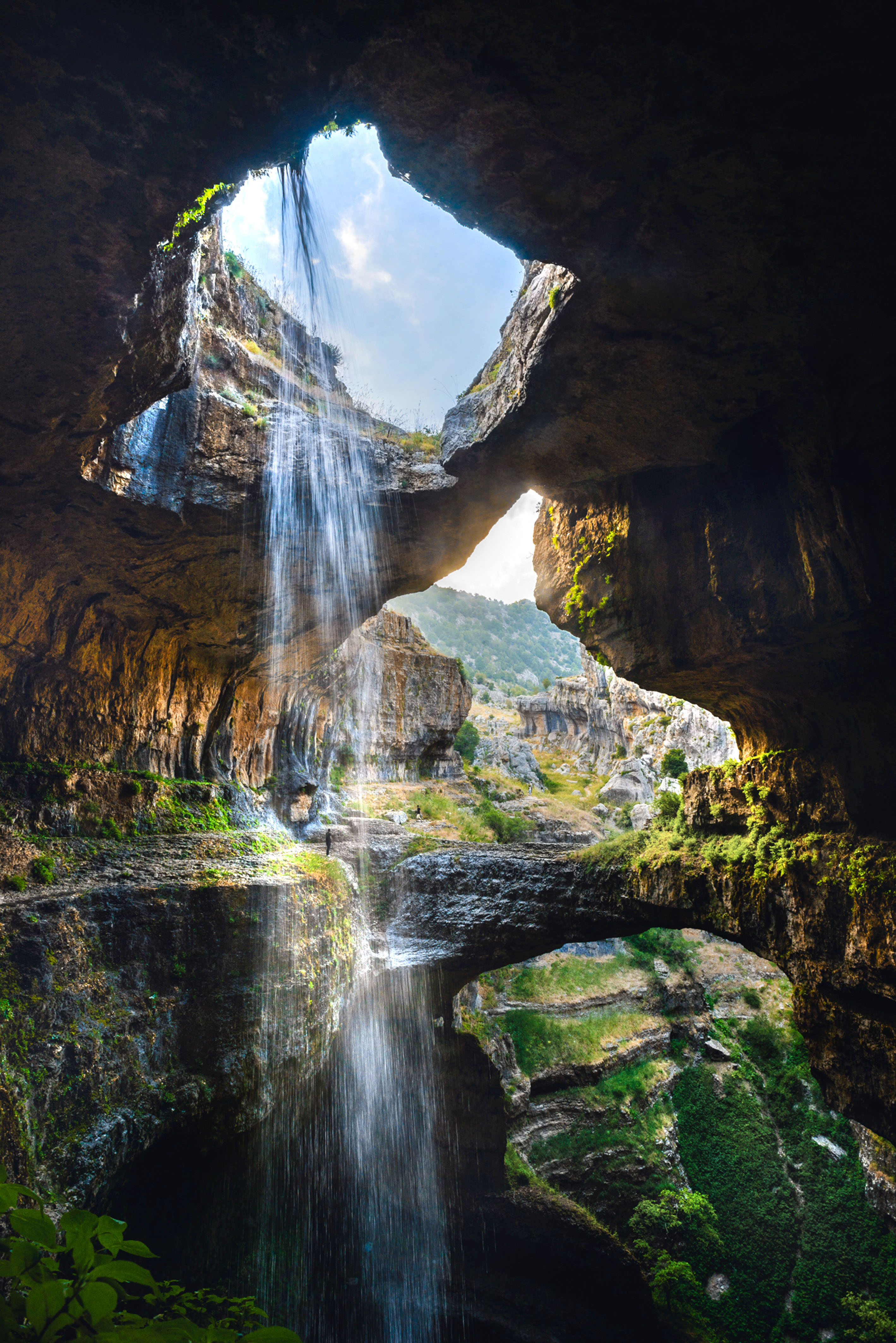 PIC BY RALPH AZAR/ CATERS NEWS - (PICTURED: The three bridge waterfall taken from inside the fall) - These stunning pictures of beautiful waterfalls will take your breath away. The mystical waterfall trickles down through unique circular rock formations, echoing around cavernous gorge. The incredible series of snaps were caught on camera by Ralph Azar and Jack Seikaly, from Beirut, Lebanon, at the Baatara Gorge waterfall, near Tannourine in northern Lebanon. Ralph, 28, said: I tried lots of different angles I wanted to show the grandeur of this place without actually paying attention to where I was going. SEE CATERS COPY.
