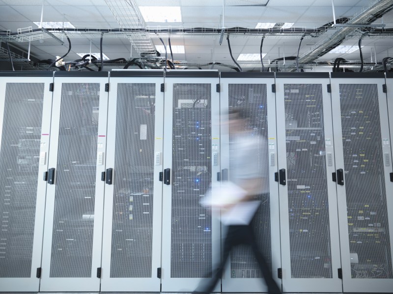 Blurred view of man in server room