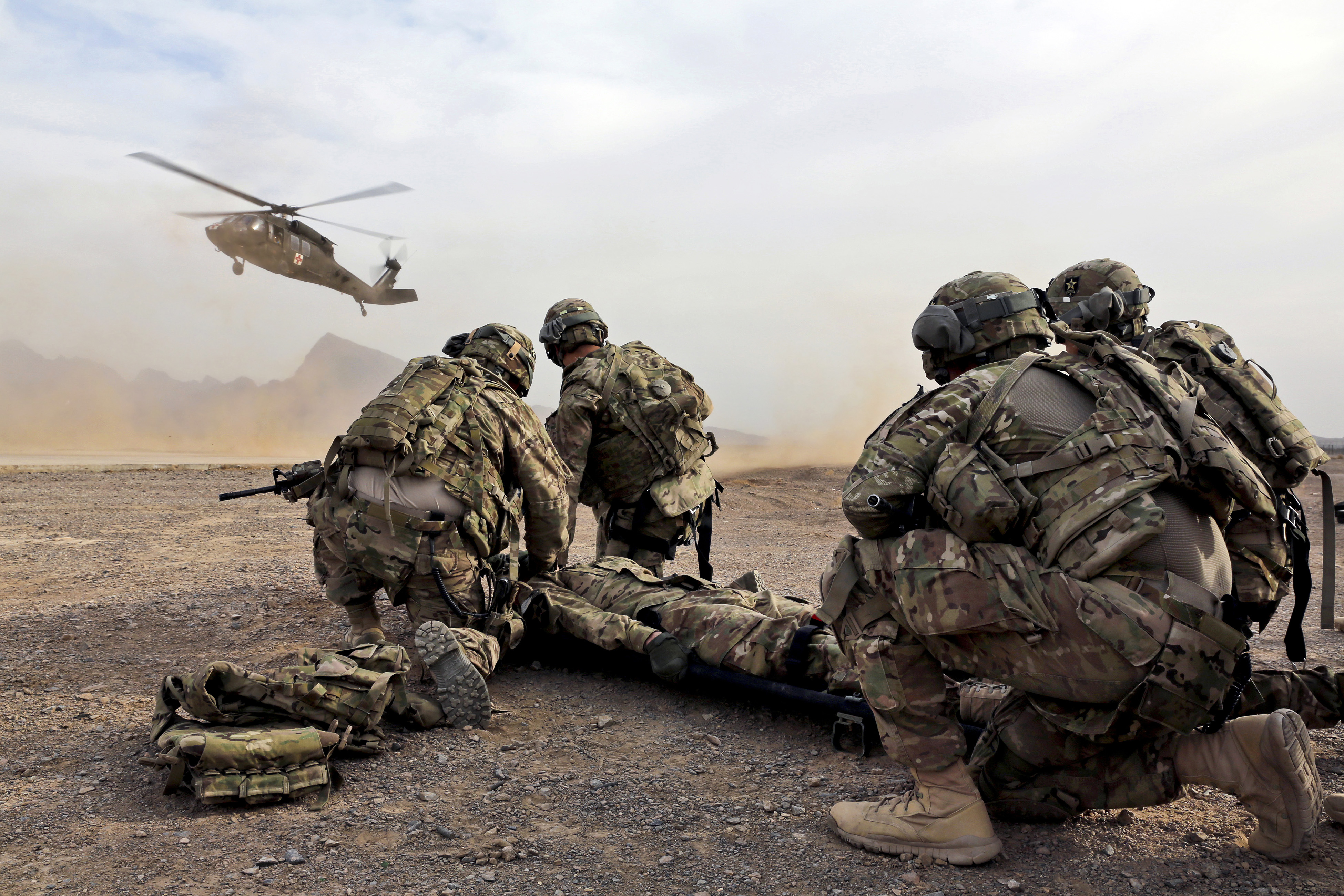 January 9, 2013 - Security force team members for Provincial Reconstruction Team (PRT) Farah wait for a UH-60 Blackhawk medevac helicopter to land before moving a simulated casualty during medical evacuation training on FOB Farah, Afghanistan.

http://www.npr.org/sections/health-shots/2016/05/31/480146514/from-medical-maggots-to-stench-soup-grunt-explores-the-science-of-warfare