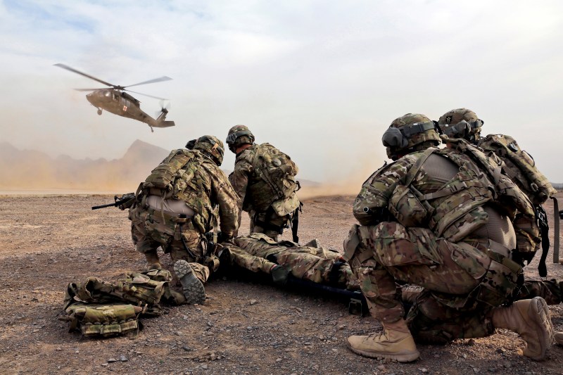 January 9, 2013 - Security force team members for Provincial Reconstruction Team (PRT) Farah wait for a UH-60 Blackhawk medevac helicopter to land before moving a simulated casualty during medical evacuation training on FOB Farah, Afghanistan. http://www.npr.org/sections/health-shots/2016/05/31/480146514/from-medical-maggots-to-stench-soup-grunt-explores-the-science-of-warfare