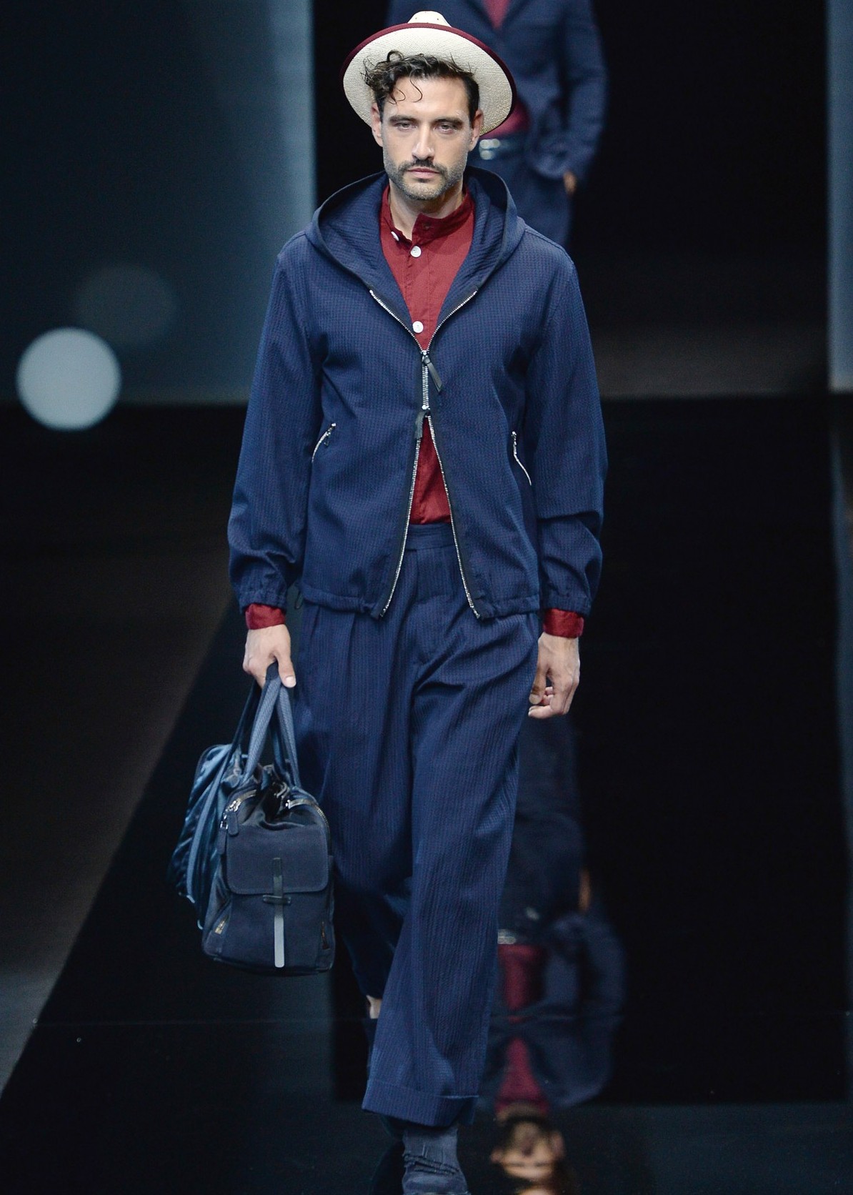 A model walks the runway at the Giorgio Armani Spring/Summer 2017 fashion show during Milan Menswear Fashion Week on June 21, 2016 in Milan, Italy. (Catwalking/Getty Images)