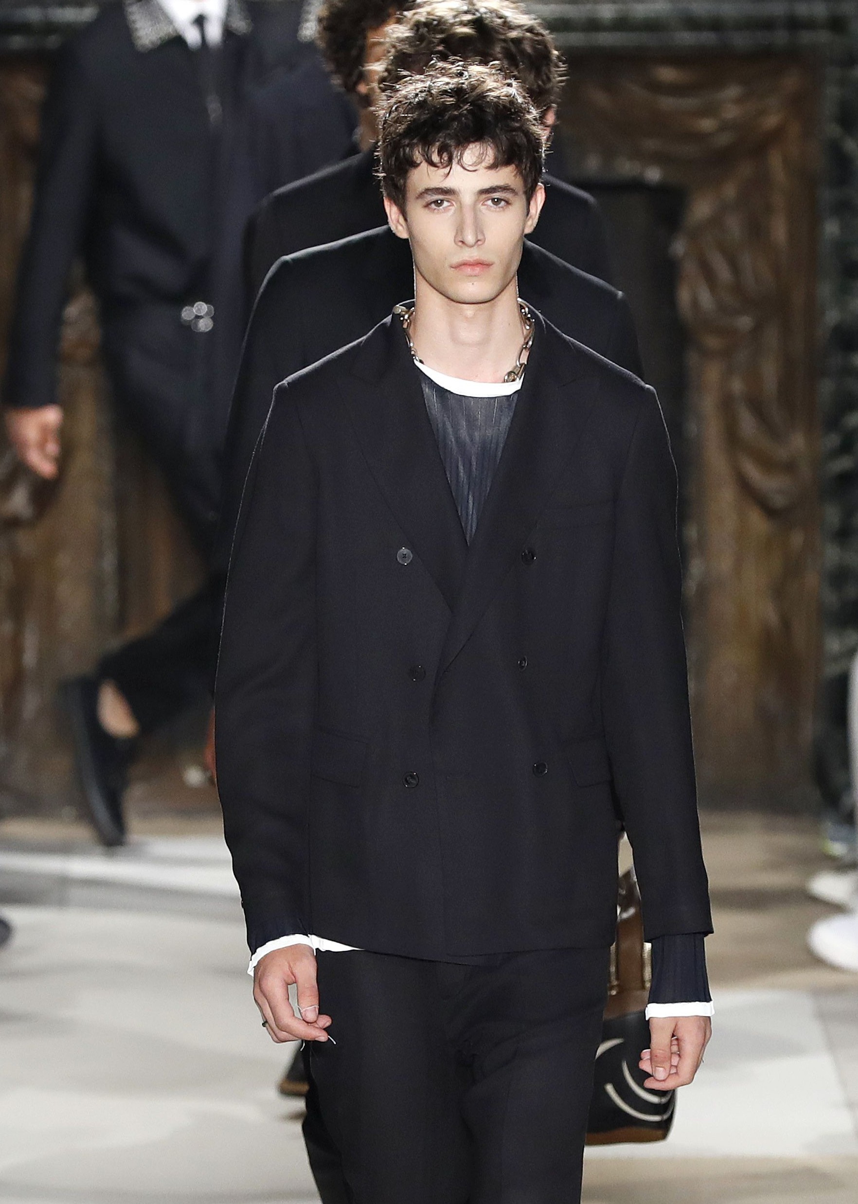 Models present creations by Valentino during the Men's Spring/Summer 2017 collection fashion show on June 22, 2016 in Paris. (Patrick Kovarik/AFP/Getty Images)