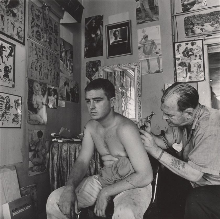 “Bill Sanders, Tattoo Artist, Houston, Texas,” 1968. Vintage gelatin silver print.(Danny Lyon, courtesy Edwynn Houk Gallery, New York)