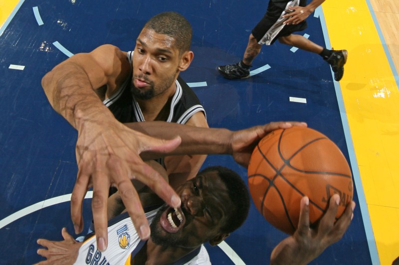 MEMPHIS, TN - MARCH 1: Tony Allen #9 of the Memphis Grizzlies shoots against Tim Duncan #21 of the San Antonio Spurs on March 1, 2011 at FedExForum in Memphis, Tennessee. NOTE TO USER: User expressly acknowledges and agrees that, by downloading and or using this photograph, User is consenting to the terms and conditions of the Getty Images License Agreement. Mandatory Copyright Notice: Copyright 2011 NBAE (Photo by Joe Murphy/NBAE via Getty Images)