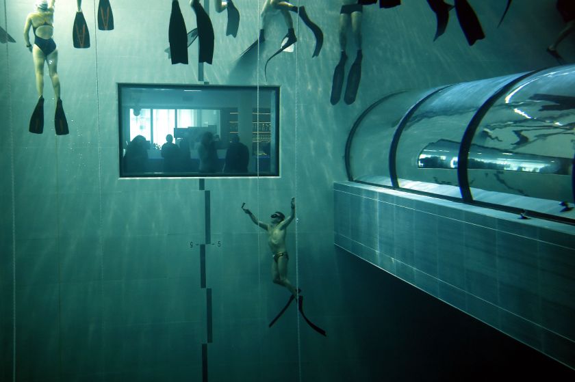 Italian former legend of free diving, Umberto Pelizzari (bottom) gives an apnea course at the "Y-40 The Deep Joy" swimming pool on December 8, 2014 in Montegrotto Terme, northeastern Italy. The swimming pool is built over thermal sources bringing after cooling down a water at 32-34 degrees Celsius. Y-40, with its depth of 42mt, is officially included in the Guinness World Record as the deepest pool in the world for free and scuba diving. (Olivier Morin/AFP/Getty Images)