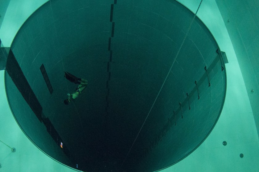 A student swims during an apnea course by Italian free diver, Umberto Pelizzari, at the "Y-40 The Deep Joy" swimming pool on December 8, 2014 in Montegrotto Terme, northeastern Italy. The swimming pool is built over thermal sources bringing after cooling down a water at 32-34 degrees Celsius. Y-40, with its depth of 42mt, is officially included in the Guinness World Record as the deepest pool in the world for free and scuba diving. AFP PHOTO / OLIVIER MORIN (Photo credit should read OLIVIER MORIN/AFP/Getty Images)