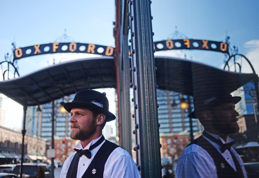 Leo Krizan, Bell Captain, at The Oxford Hotel, waits for guest to arrives. (RJ Sangosti/The Denver Post via Getty Images)