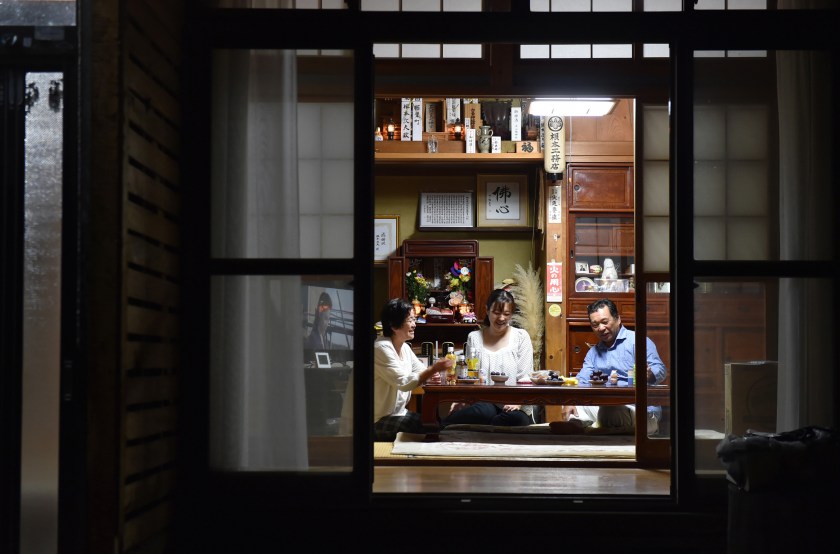A returned family have dinner at their house as the evacuation order was lifted on September 5, 2015 in Naraha, Japan. (The Asahi Shimbun via Getty Images)