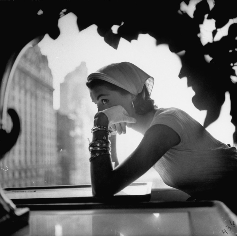 Model wearing nursemaid's kerchief which has a stiff coronet and strings that go under hair to tie through a loop at its back. (Gordon Parks/The LIFE Picture Collection/Getty Images)