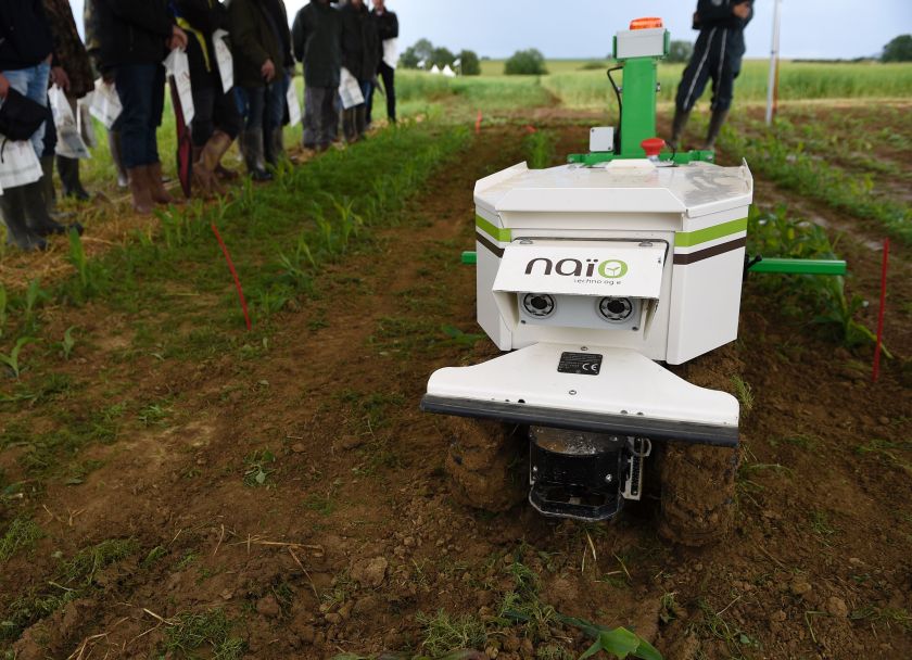 Farmers look at a weeding robot during a demonstration of new technologies "Digifermes" (Digital farms) at the Arvalis farm, an applied agricultural research organisation dedicated to arable crops. (Jean-Christophe Verhaegen/AFP/Getty Images)