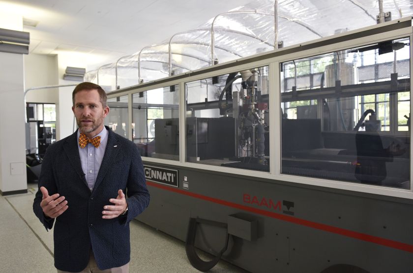 Local Motors CEO and co-founder John B. Rogers, Jr. speaks during an interview following the launch of the "Olli" autonomous shuttle at the Local Motors facility in the National Harbor, Maryland on June 16, 2016. The electric self-driving shuttle is a partnership between Local Motors and IBM, using IBM's Watson supercomputer. / AFP / Mandel Ngan (Photo credit should read MANDEL NGAN/AFP/Getty Images)