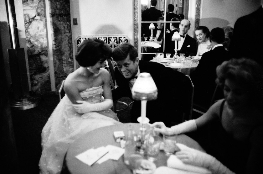 Senator (and future US President) Jack Kennedy (1917 - 1963) lending an ear to his wife Jacqueline (1929 - 1994) as they sit at table at the Waldorf Astoria Hotel, New York, New York, November 22, 1956. They were there during cocktail hour before dining at a society gala sponsored by the wife of the US ambassador to Cuba. (Photo by Alfred Eisenstaedt/The LIFE Picture Collection/Getty Images)