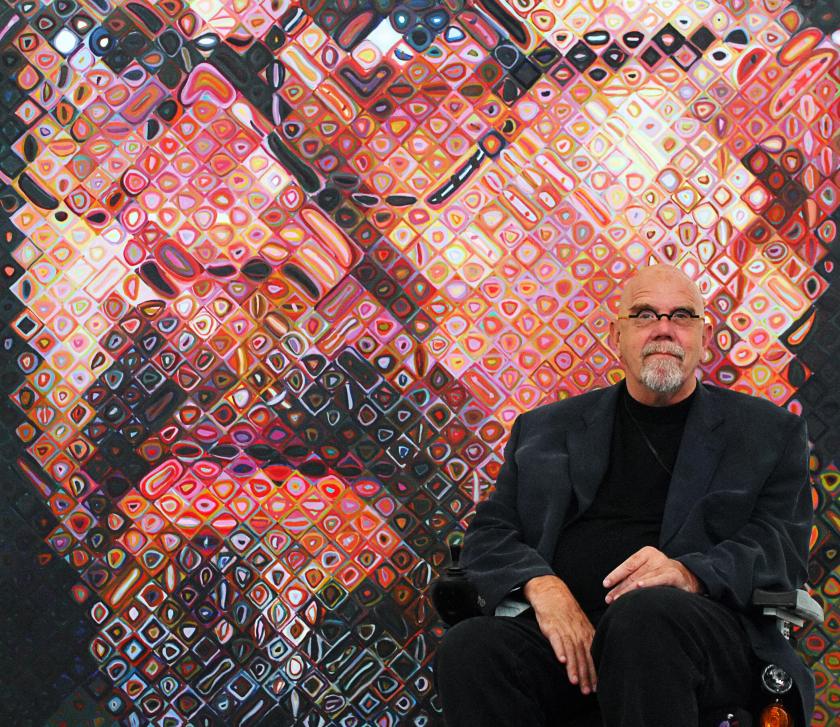 Chuck Close sits in front of one of his paintings, a self Portrait, 24 May 2007 on show at the exhibition "Chuck Close returned looks, Portraits 1969 / 2006" in the "Ludwig Forum" in Aachen, western Germany. (Henning Kaiser/AFP/Getty Images)