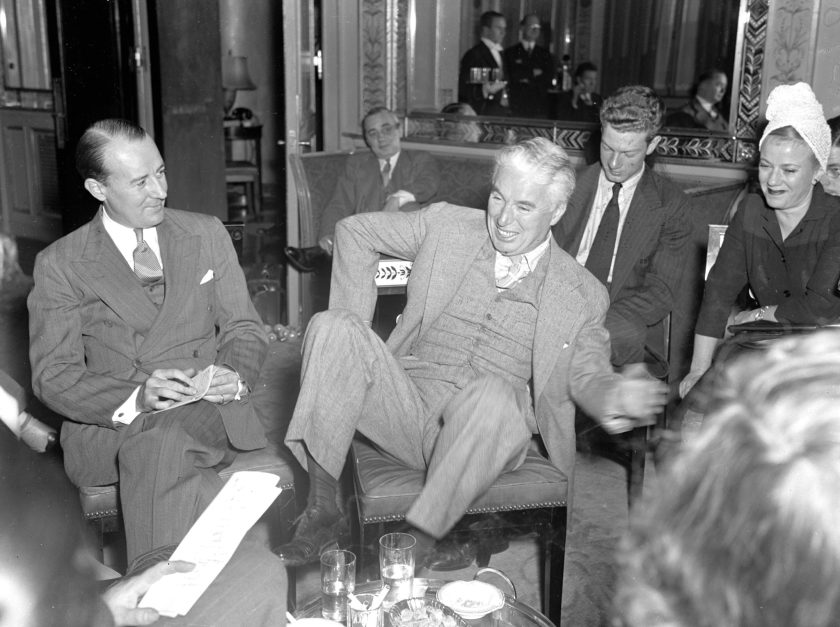 UNITED STATES - OCTOBER 13: Charlie Chaplin being interviewed by reporters at the Waldorf Astoria. (Photo by Walter Kelleher/NY Daily News Archive via Getty Images)