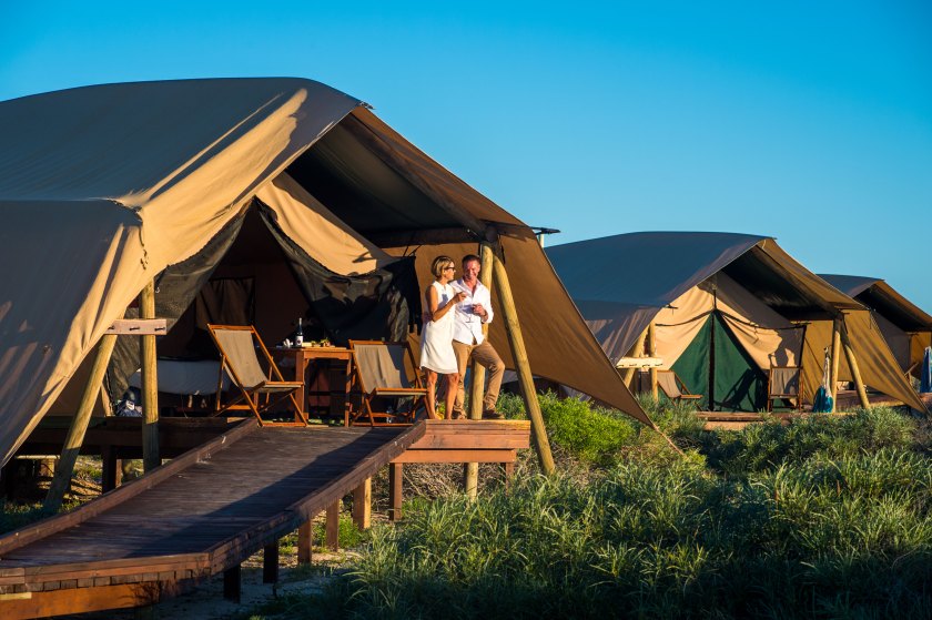 Couple by tent at Sal Salis Ningaloo Reef (Courtesy Western Australia Tourism)