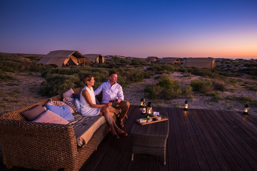 Couple watching sunset at Sal Salis Ningaloo Reef (Courtesy Western Australia Tourism)