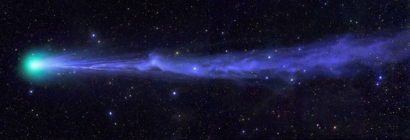 Comet Lovejoy soars through the night sky in a green haze with an ion tail in its wake. The image shows Lovejoy appearing to lose its tail on 21 January 2015. (Michael Jaeger)