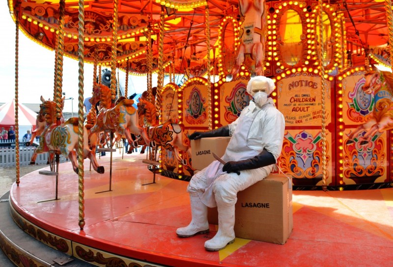 WESTON-SUPER-MARE, ENGLAND - AUGUST 28: A sculpture depicts a 'horse meat' butcher on a carousel as Banksy's Dismaland Bemusement Park opens to the public, on August 28, 2015 in Weston-Super-Mare, England. Graffiti artist Banksy has opened the subversive, pop-up theme park styled exhibition at the derelict seafront Tropicana lido, featuring the work of 50 artists. The 'Bemusement Park' combines dark humour and 'entry-level anarchism' and will open for just five weeks. (Photo by Jim Dyson/Getty Images)
