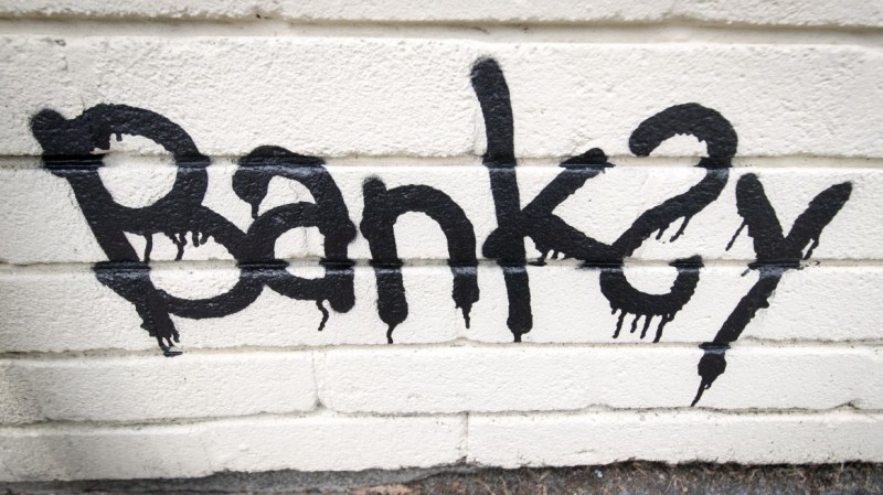 The name Banksy is written as part of a mural which was painted on the side of one of the classrooms at Bridge Farm Primary in Bristol during half-term on June 7, 2016, in Bristol, England. The 14-foot piece was said to be a thank you by the elusive artist after the school recently named a house after him. (Matt Cardy/Getty Images)