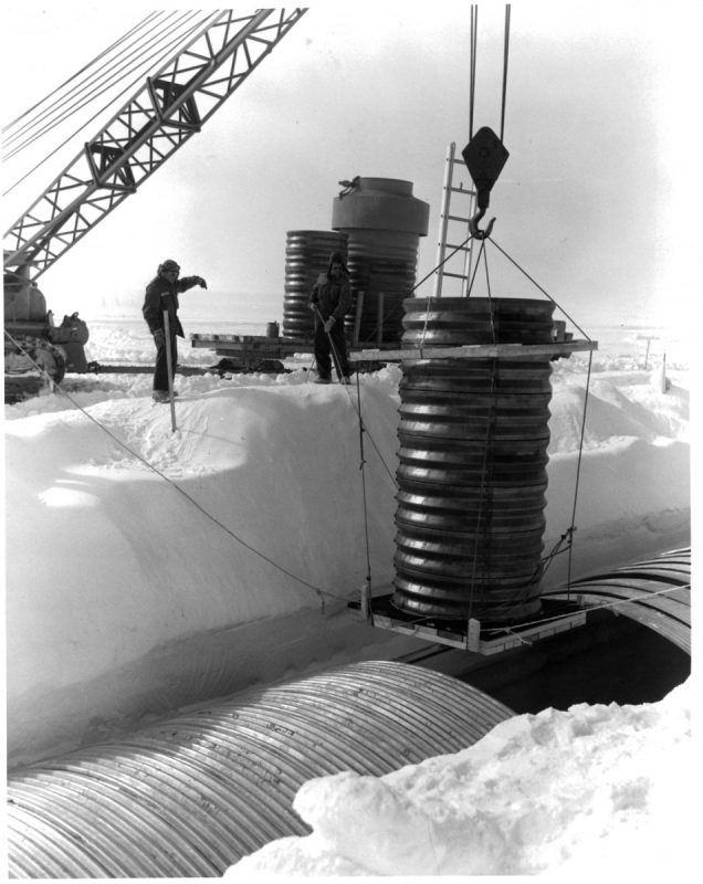 A crane lowers a hatch into a lateral trench of the permanent camp at Camp Century in Greenland. (Photo by Pictorial Parade/Archive Photos/Getty Images)
