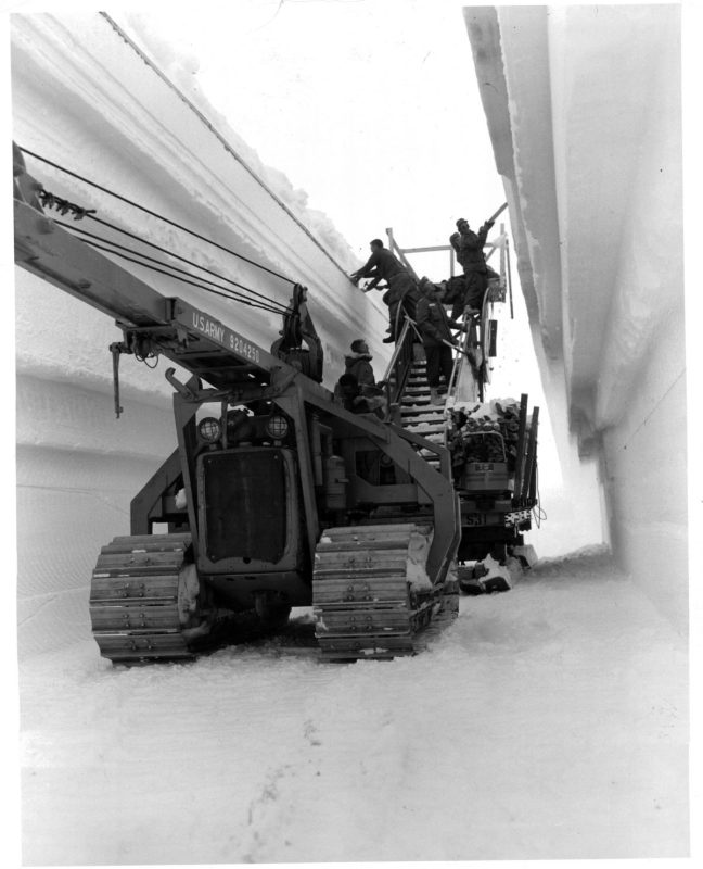 Men place arch supports in the tunnel to main trench of the permanent camp at Century Camp, Greenland. (Photo by Pictorial Parade/Archive Photos/Getty Images)