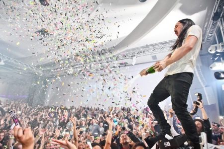 LOS ANGELES, CA - JANUARY 18:  DJ Steve Aoki sprays the audience with champagne at his record release event celebrating "Wonderland" at SupperClub Los Angeles on January 18, 2012 in Los Angeles, California.  (Photo by Chelsea Lauren/Getty Images)