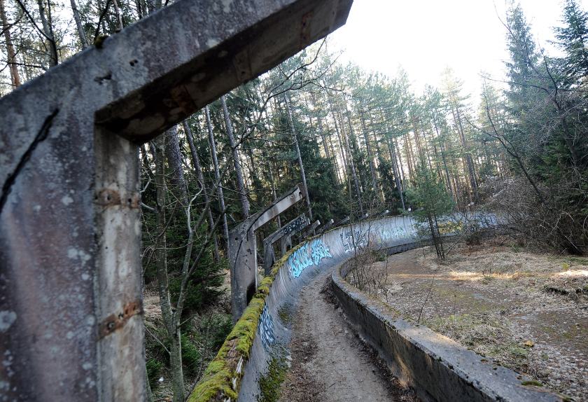 TO GO WITH STORY BY RUSMIR SMAJILHODZIC - A picture taken on February 5, 2014 shows Sarajevo's abandoned Sarajevo's bob sleigh track near Sarajevo. Built and used as an Olympic venue during Sarajevo's 1984 Winter Olympic Games, the track was heavily damaged during Bosnia's 1992-95 war. It was never rebuilt and it's large concrete fragments remain standing as a memento of past and training ground for young generations of graffiti artists. AFP PHOTO ELVIS BARUKCIC / AFP / ELVIS BARUKCIC (Photo credit should read ELVIS BARUKCIC/AFP/Getty Images)