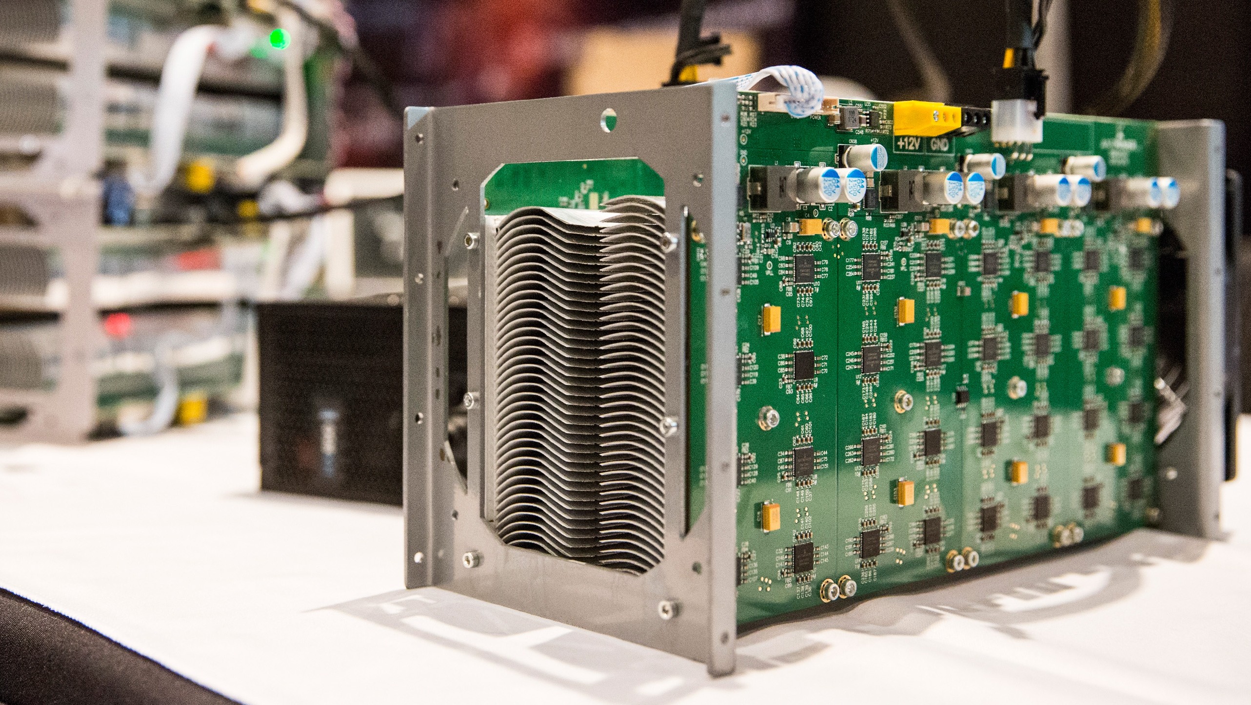 Bitcoin mining hardware is displayed at a Bitcoin conference on at the Javits Center April 7, 2014 in New York City. Topics included market places to trade bitcoin, mining hardware to harvest bitcoins and digital wallets to store bitcoins. Bitcoin is one of the most popular of over one hundred digital currencies that have recently come into popularity.  (Andrew Burton/Getty Images)