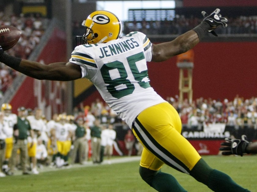 GLENDALE, AZ - JANUARY 10: Wide receiver Greg Jennings #85 of the Green Bay Packers catches the ball for a touchdown against the Arizona Cardinals during the third quarter of the 2010 NFC wild-card playoff game at University of Phoenix Stadium on January 10, 2010 in Glendale, Arizona. (Photo by Jeff Gross/Getty Images)