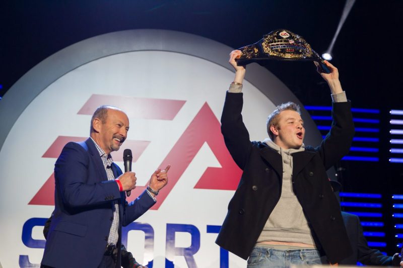 SAN FRANCISCO, CA - FEBRUARY 04: EA chief operating officer Peter Moore awards the Madden Challenge Championship belt to Serious Moe at Nob Hill Masonic Center on February 4, 2016 in San Francisco, California. (Photo by Miikka Skaffari/FilmMagic)