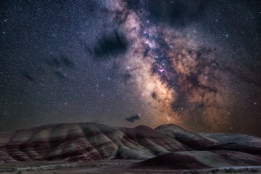 With very little light pollution, the glimmering stars of the Milky Way bathe the colourful layers of the Painted Hills of Oregon in a natural glow. (Nicholas Roemmelt)