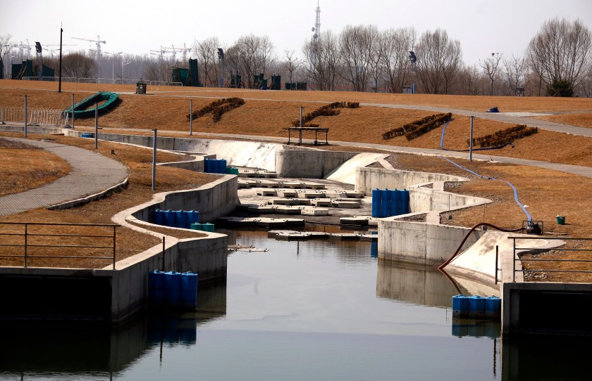 The word "Dream" can be seen above the deserted and unmaintained former course for the kayaking competition of the 2008 Beijing Olympic Games, located on the outskirts of Beijing March 27, 2012. The gigantic infrastructures built for the Beijing Olympics, namely the "Bird's Nest", and the National Aquatics Centre, also known as the "Water Cube", are now used for cultural and sports events, reminding the world of the flare that blazed during the summer of 2008. However, some other Beijing Olympic venues, such as the rowing and kayaking centre, baseball arena and BMX track, have been left either deserted or been completely demolished. Picture taken March 27, 2012. REUTERS/David Gray (CHINA - Tags: SPORT OLYMPICS) - RTR30INS