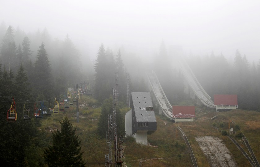 A general view of the disused ski jump from the Sarajevo 1984 Winter Olympics shrouded in mist on Mount Igman, near Sarajevo September 19, 2013. Abandoned and left to crumble into oblivion, most of the 1984 Winter Olympic venues in Bosnia's capital Sarajevo have been reduced to rubble by neglect as much as the 1990s conflict that tore apart the former Yugoslavia. (Reuters/Dado Ruvic)