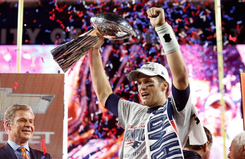 Tom Brady #12 of the New England Patriots celebrates with the Vince Lombardi Trophy after defeating the Seattle Seahawks 28-24 to win Super Bowl XLIX at University of Phoenix Stadium on February 1, 2015 in Glendale, Arizona. (Photo by Christian Petersen/Getty Images)