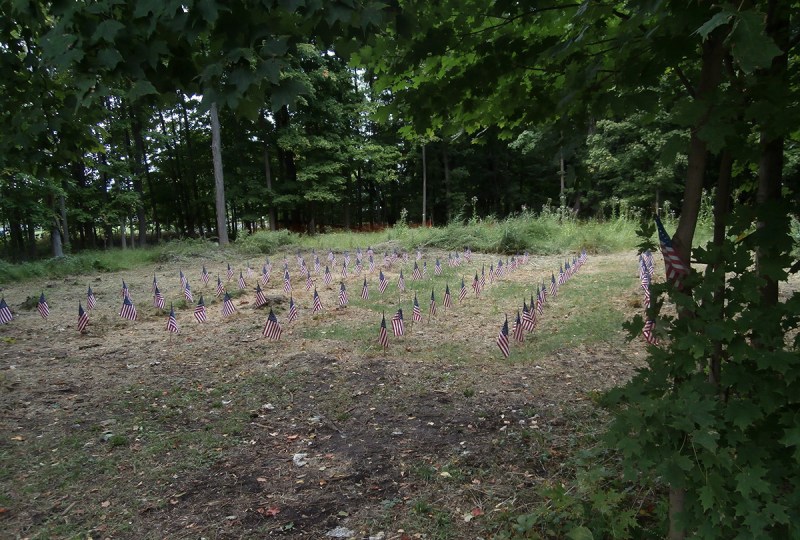 Photo of the burial ground taken after the conclusion of the 4th annual Revolutionary War Weekend. 60 flags were placed to represent the 60 soldiers identified by our research team up to that point. Our count now stands at 86. (Friends of the Fishkill Supply Depot)