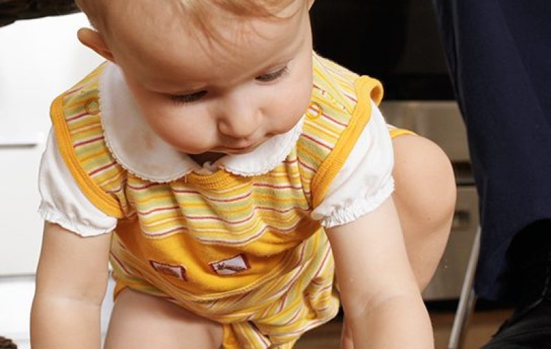Child eating off floor. (Getty Images)