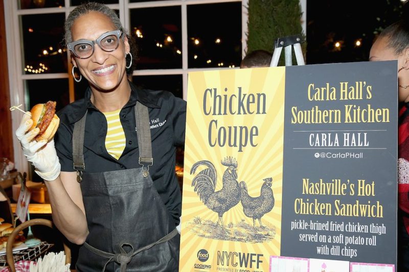 NEW YORK, NY - OCTOBER 15: Carla Hall, Co-host of The Chew, and owner of Carla Halls Southern Kitchen poses with her dish; Nashville's Hot Chicken Sandwich at Chicken Coupe hosted by Whoopi Goldberg during Food Network & Cooking Channel New York City Wine & Food Festival presented by FOOD & WINE at The Loeb Boathouse on October 15, 2015 in New York City. (Photo by Monica Schipper/Getty Images for NYCWFF)