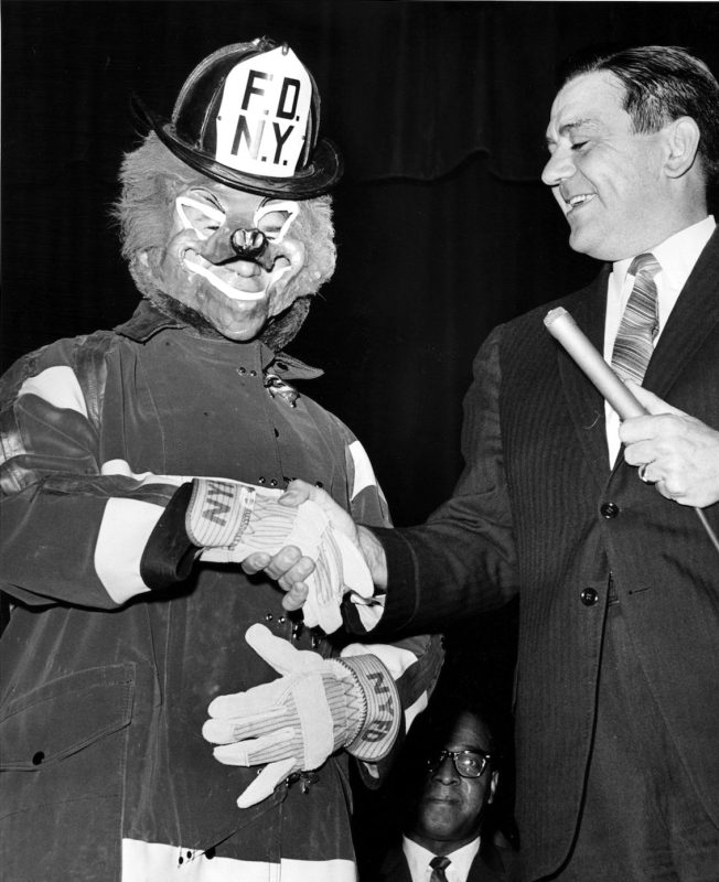Foxy the firefighter appeared today for the inauguration of a Crusade to save lives and is introduced by the fire Commish. Edward Thompson, during ceremonies at the high school of fashion industries. March 13, 1964. (Photo by Louis Liotta / (c) NYP Holdings, Inc. via Getty Images)