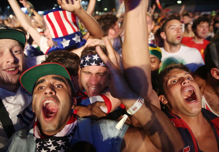 American fans celebrate after the U.S. scored to take a 2-1 lead over Portugal while watching a video broadcast at the FIFA Fan Fest on Copacabana Beach during the 2014 FIFA World Cup Brazil on June 22, 2014 in Rio de Janeiro, Brazil. The game ended in a 2-2 tie. (Photo by Mario Tama/Getty Images)