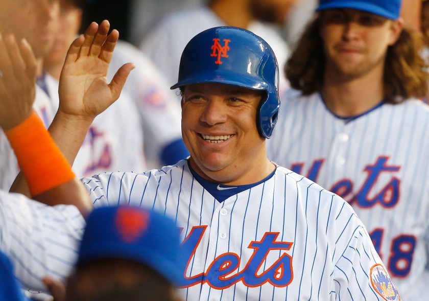 Bartolo Colon #40 of the New York Mets celebrates in the dugout after scoring a third-inning run against the Pittsburgh Pirates at Citi Field on June 16, 2016 in the Flushing neighborhood of the Queens borough of New York City. (Jim McIsaac/Getty Images)