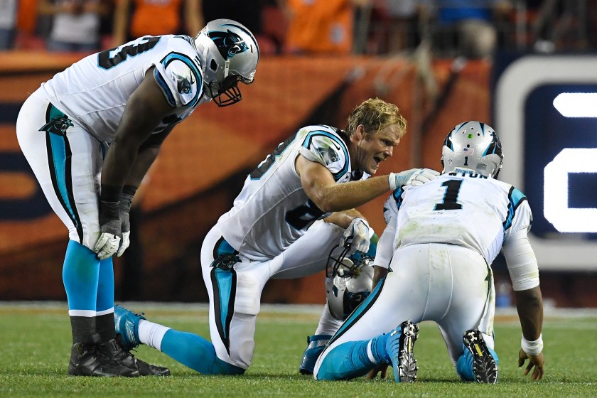 Greg Olsen (88) of the Carolina Panthers and Donald Hawkins (78) check the health of Cam Newton (1) after he was pummeled by Shaquil Barrett (48) of the Denver Broncos and Darian Stewart (26) during the fourth quarter of the Broncos' 21-20 win. The Denver Broncos hosted the Carolina Panthers on Thursday, September 8, 2016. (Helen H. Richardson/The Denver Post via Getty Images)