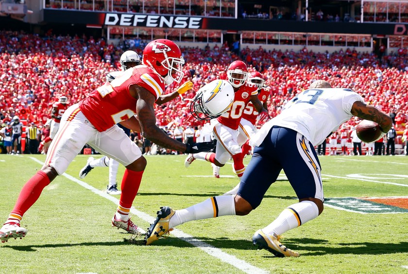 KANSAS CITY, MO - SEPTEMBER 11: Defensive back Marcus Peters #22 of the Kansas City Chiefs rips the helmet off of wide receiver Keenan Allen #13 of the San Diego Chargers during the game at Arrowhead Stadium on September 11, 2016 in Kansas City, Missouri. (Photo by Jamie Squire/Getty Images)