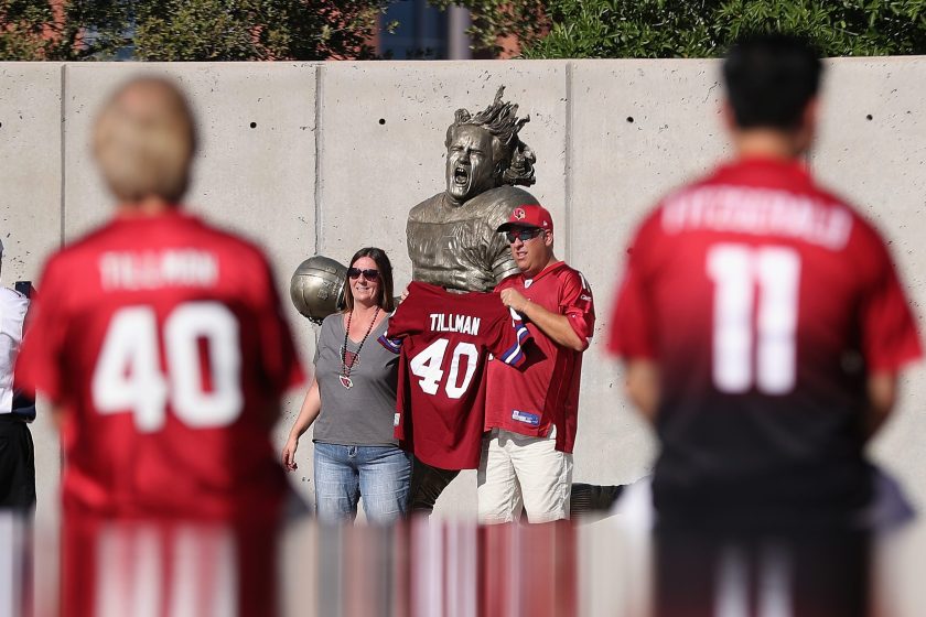 Fans pose in front of the Pat Tillman statue before the NFL game between the Arizona Cardinals and New England Patriots at the University of Phoenix Stadium on September 11, 2016 in Glendale, Arizona. (Christian Petersen/Getty Images)