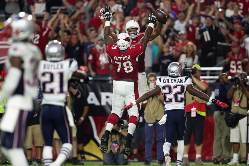 GLENDALE, AZ - SEPTEMBER 11: Wide receiver Larry Fitzgerald #11 of the Arizona Cardinals celebrates his 100th career touchdown with offensive tackle Earl Watford #78 during the fourth quarter of the NFL game against the New England Patriots at the University of Phoenix Stadium on September 11, 2016 in Glendale, Arizona. (Photo by Christian Petersen/Getty Images)