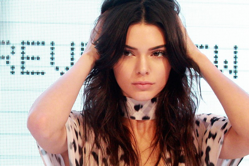 SYDNEY, AUSTRALIA - NOVEMBER 17: Kendall Jenner adjusts her hair on stage at Westfield Parramatta on November 17, 2015 in Sydney, Australia. (Photo by Lisa Maree Williams/Getty Images)