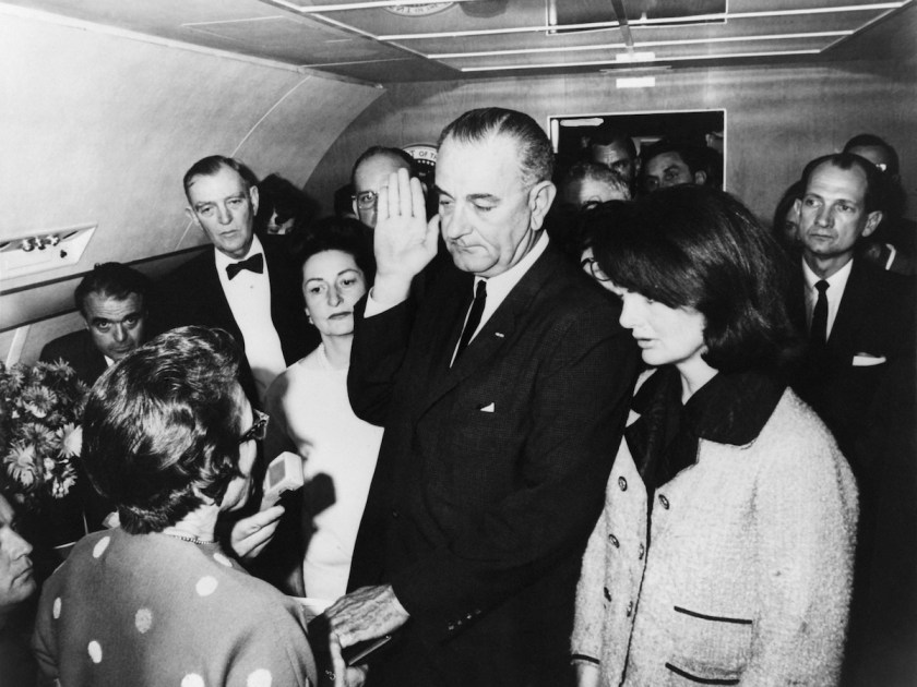 Lyndon Johnson (C) taking oath of office after President Kennedy's assassination aboard Air Force One, Former First Lady Jackie Kennedy (R), imminent First Lady Lady Bird (L), Jack Valenti, Congressmen Albert Thomas on november 22, 1963 in United States. (Keystone-France/Gamma-Keystone via Getty Images)