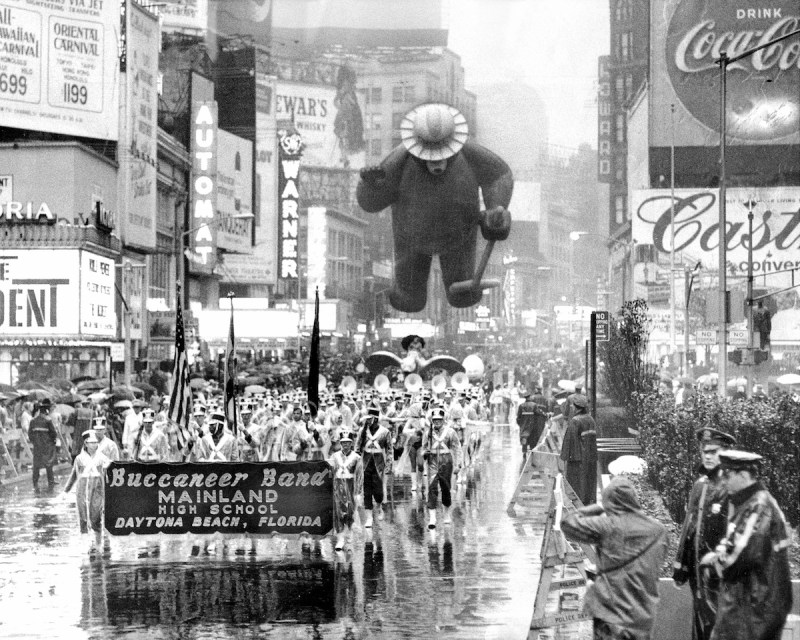 UNITED STATES - NOVEMBER 23: Even Smokey the Bear seems to be ducking the precipitation on rain-slick Broadway. It was a fowl day and the weatherman laid a turkey's egg. a steady, day-long downpour spread blessings from above that would have been better appreciated if last year's water shortage were still with us. Still, millions were the more comfortable for their warm homes and holiday feasts as they gazed through their windows, thankful not to be out in the rain. A hardy 120,000 turned out, however, to take in the 41st annual Macy's Thanksgiving Day parade. (Photo by Hal Mathewson/NY Daily News Archive via Getty Images)