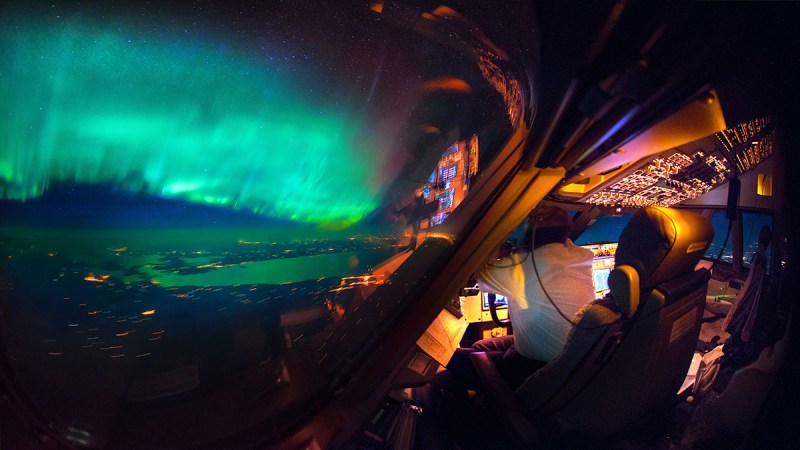 An amazing view of the Northern Lights from the cockpit. (Christiaan van Heijst Daan Krans/Caters News)