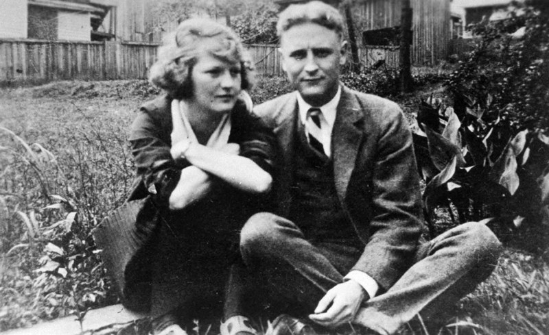 Family album snapshot of American novelist Francis Scott Key Fitzgerald (1896-1940) and wife Zelda sitting outside on lawn at her mother's home. (Photo by Time Life Pictures/Mansell/The LIFE Picture Collection/Getty Images)